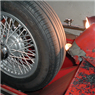 We specialize in making wire wheels run right, including using the vintage art of tire shaving.